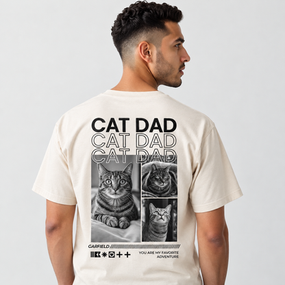 T-shirt beige avec motif de chat et inscription "CAT DAD" au dos.