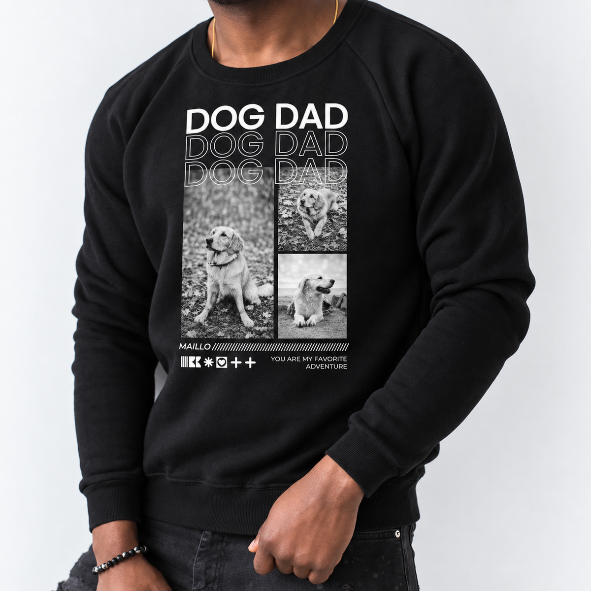 Zwarte sweater met print "DOG DAD" en hondenillustraties op de voorkant.