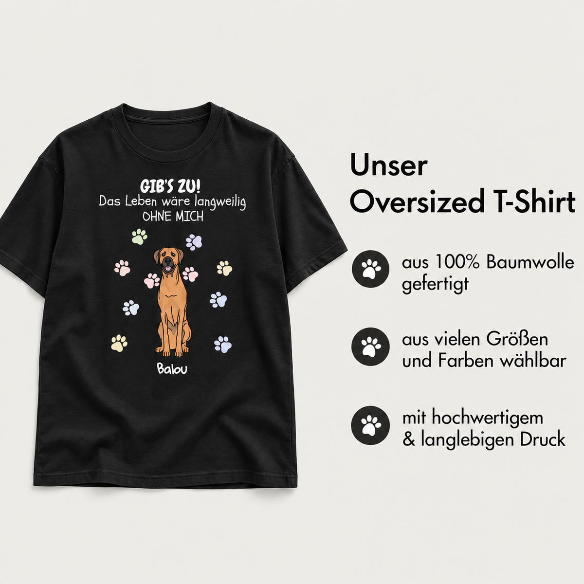 T-shirt oversize noir 100 % coton avec motif de chien et empreintes colorées.