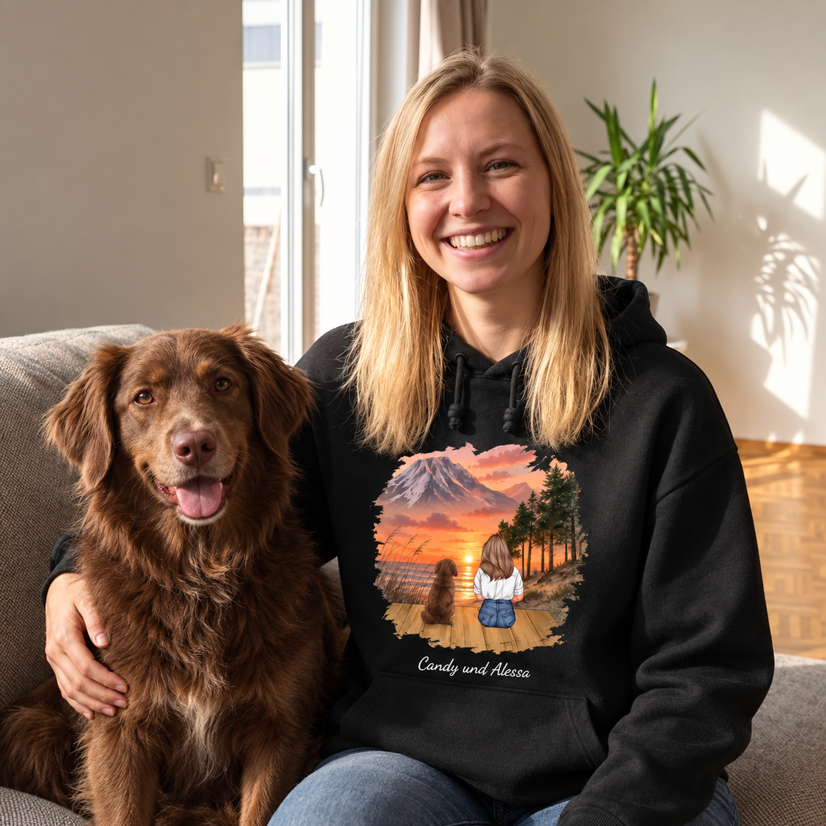 Sweat à capuche noir personnalisé avec motif d'une femme et d'un chien devant un paysage de montagne.
