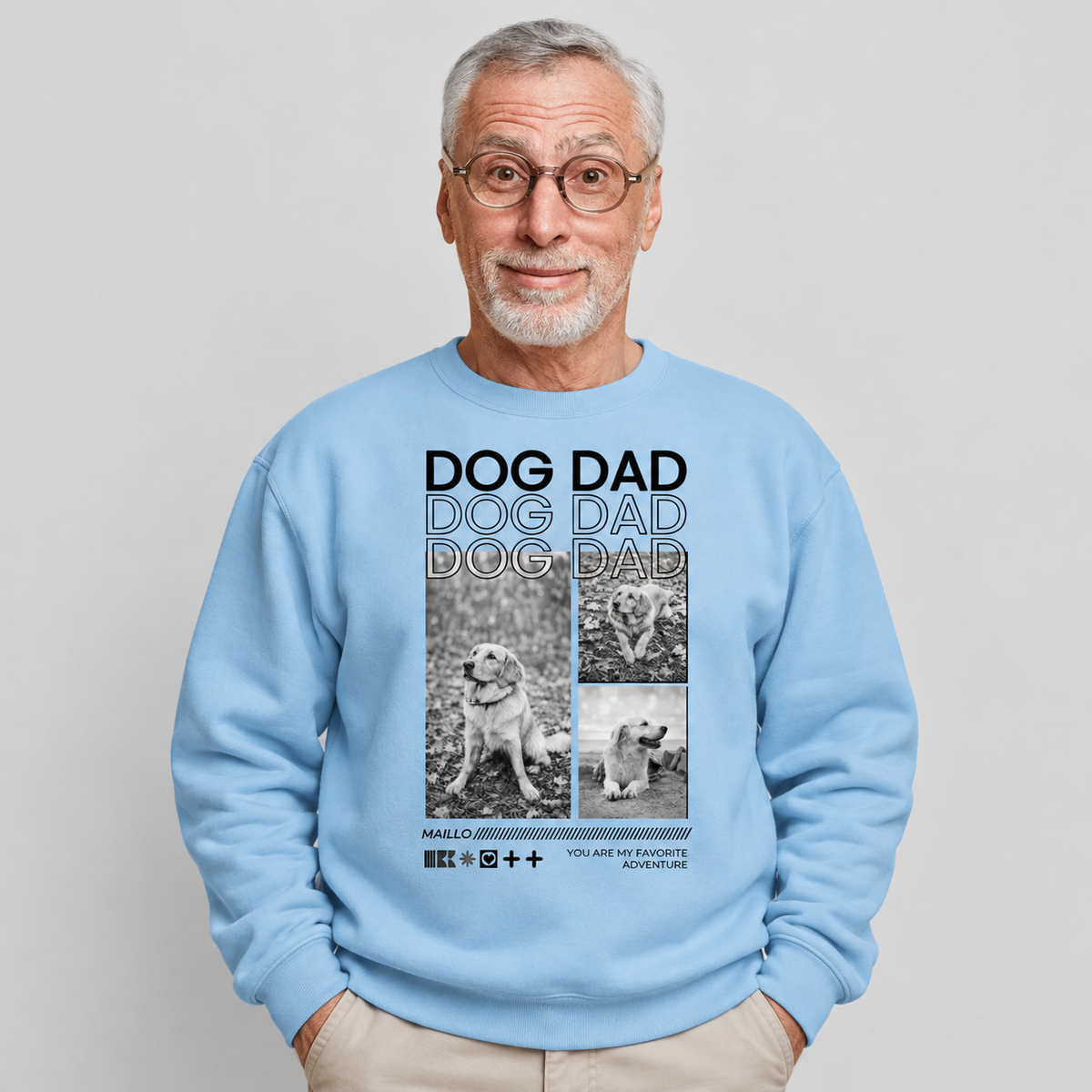 Lichte blauwgrijze sweater met opdruk "Dog Dad" en afbeeldingen van honden.