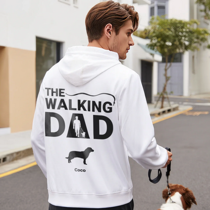 Witte hoodie met opdruk "THE WALKING DAD" en een afbeelding van hond en mens.